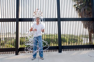 Matamoros artist Mauricio Saenz at the border fence in downtown Brownsville, Texas, USA. This picture is part of my long-term project LA FRONTERA: Artists along the US Mexican Border. © Stefan Falke / www.stefanfalke.com